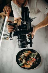 Man Taking a Video of A Beautiful Plate of Food