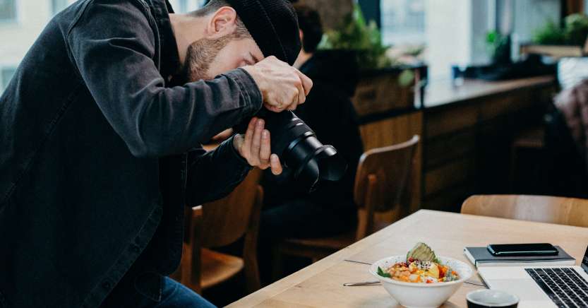Man taking photos of food