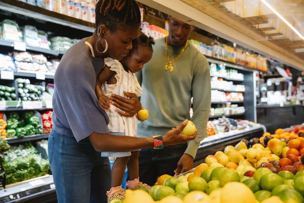 A family looks at groceries together