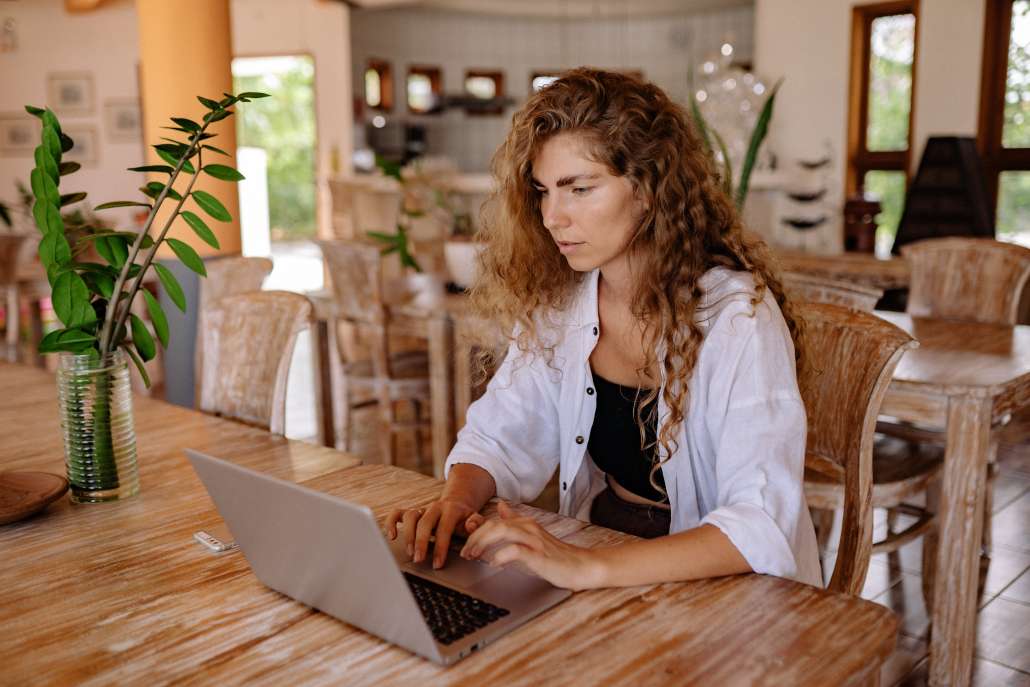 CPG Marketing Terminology - Young Woman Searching with Laptop